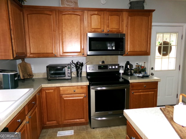 kitchen featuring sink and appliances with stainless steel finishes