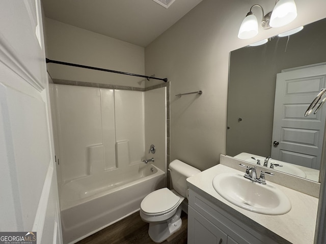 full bathroom featuring shower / bathing tub combination, vanity, hardwood / wood-style flooring, and toilet