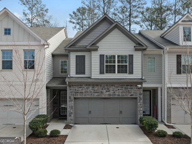 townhome / multi-family property featuring a garage