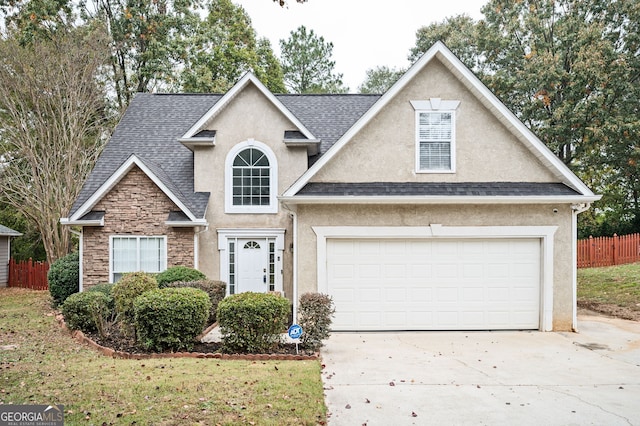 view of front of home with a front lawn and a garage