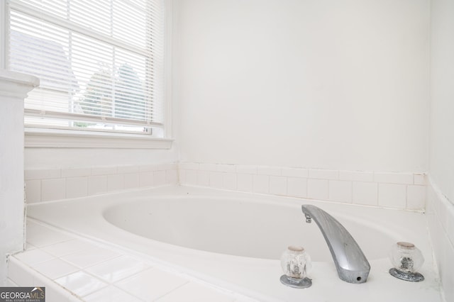 bathroom with tiled bath