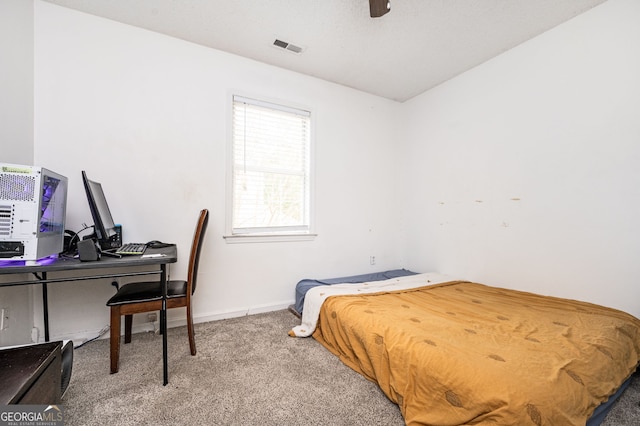 bedroom with ceiling fan and carpet floors