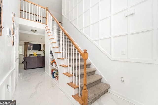 staircase with a high ceiling