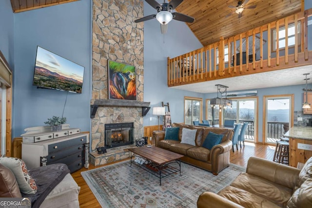 170 Walnut Rdg, Ellijay, GA 30536 - living area featuring a ceiling fan, a fireplace, wood finished floors, and high vaulted ceiling
