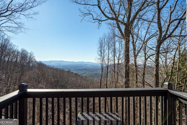 wooden terrace with a mountain view