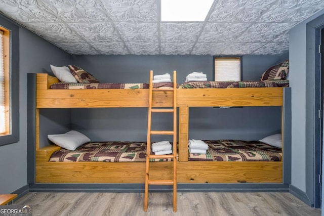 bedroom featuring hardwood / wood-style flooring