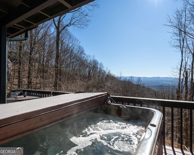 wooden deck with a mountain view