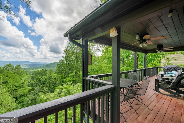 170 Walnut Rdg, Ellijay, GA 30536 - deck featuring a ceiling fan, outdoor dining area, and a wooded view