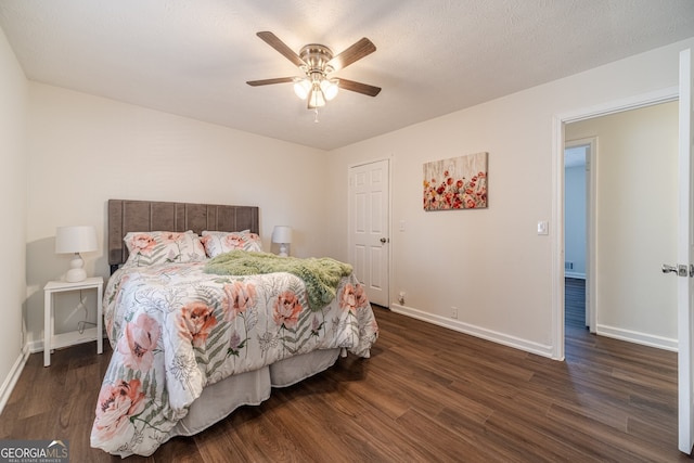 bedroom featuring ceiling fan and dark hardwood / wood-style flooring