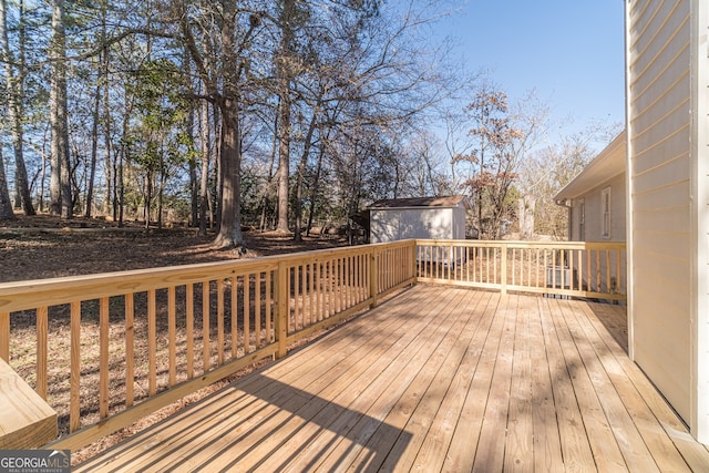 wooden terrace with a shed