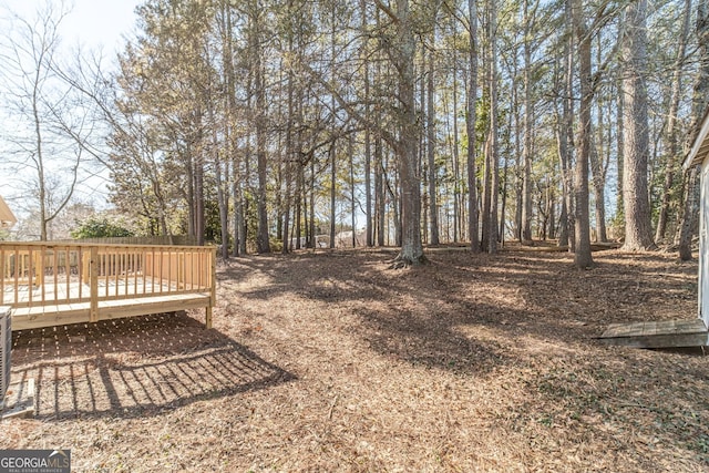 view of yard with a wooden deck