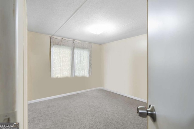 unfurnished room featuring carpet floors