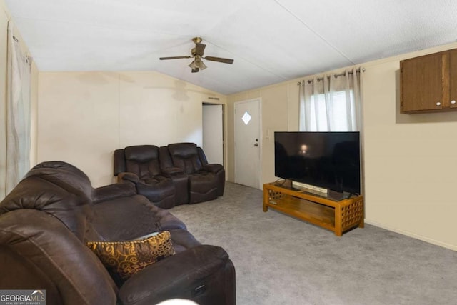 carpeted living room with vaulted ceiling and ceiling fan