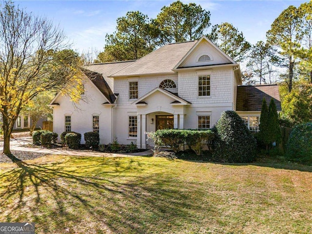 view of front of property with a front lawn