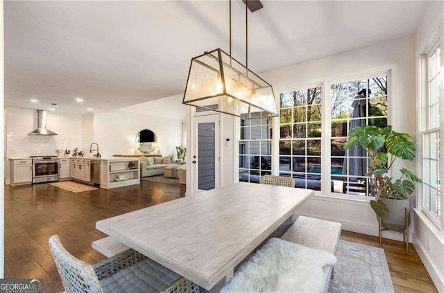 dining space featuring a chandelier and dark hardwood / wood-style floors