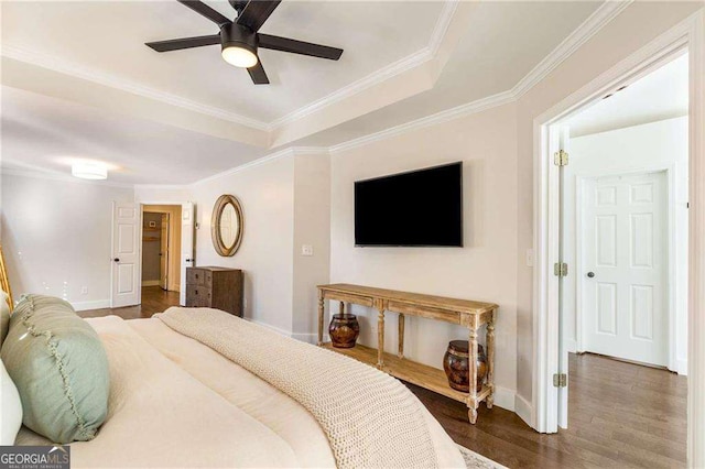 bedroom featuring ornamental molding, ceiling fan, and dark hardwood / wood-style flooring