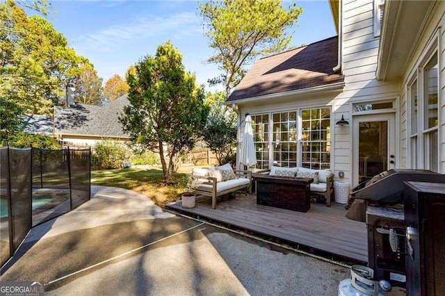 deck with an outdoor hangout area and a patio area