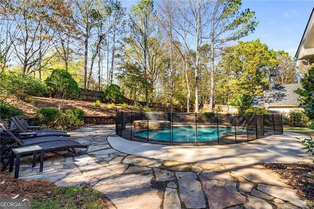 view of swimming pool featuring a patio