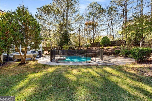 view of swimming pool featuring a patio area and a lawn