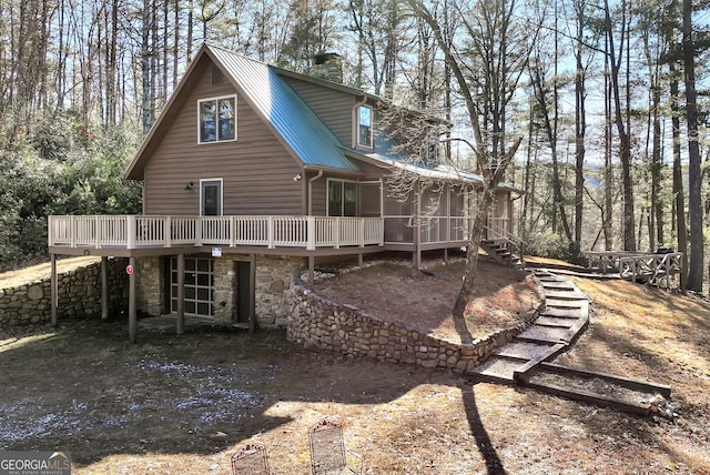 rear view of house with a deck