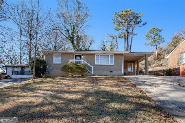 ranch-style home featuring a front yard and a carport