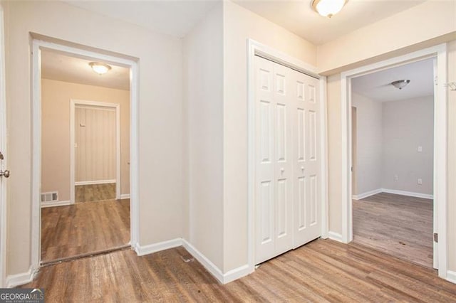 hallway featuring hardwood / wood-style flooring