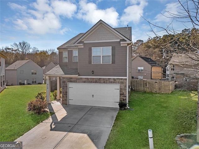 view of front of home with a front yard and a garage