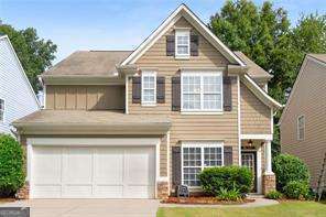 view of front facade with a garage and a front yard