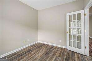 spare room featuring dark hardwood / wood-style floors