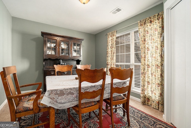 view of carpeted dining area