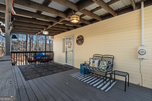 wooden deck featuring an outdoor hangout area