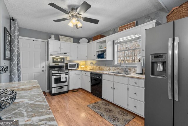 kitchen featuring sink, white cabinets, a textured ceiling, and appliances with stainless steel finishes