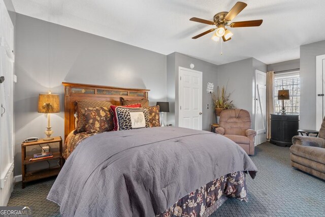 carpeted bedroom with ceiling fan