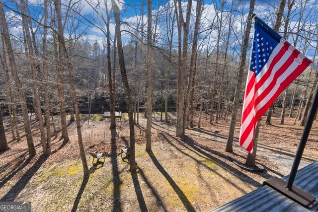 view of home's exterior with a wooden deck