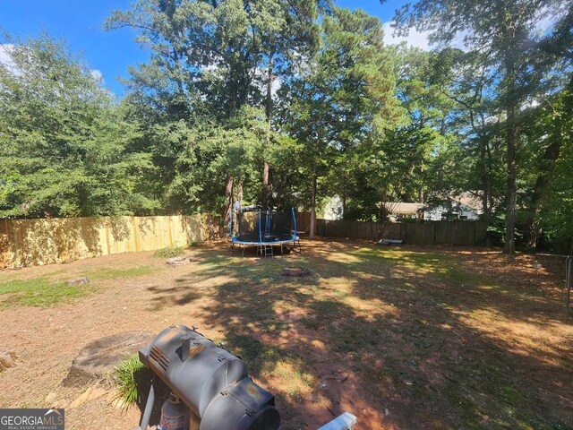 view of yard featuring a trampoline