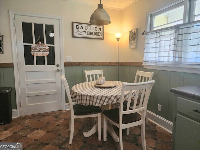 dining area featuring crown molding