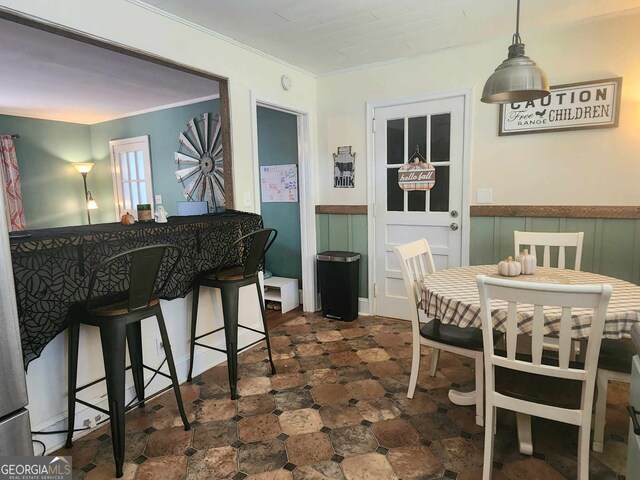 dining room featuring crown molding