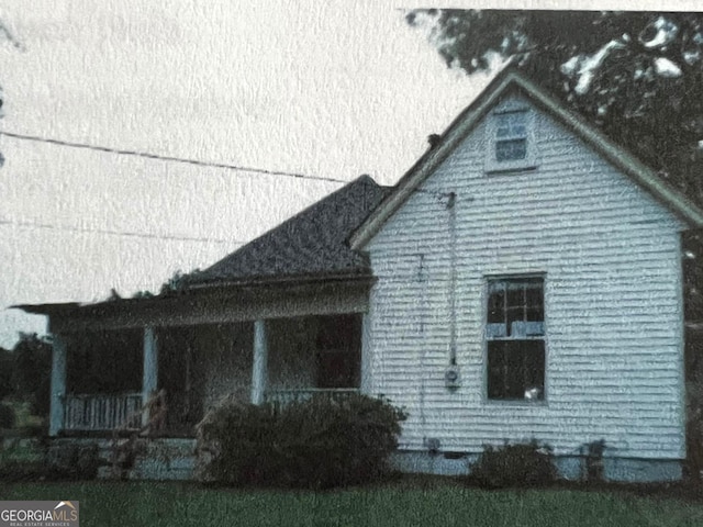 view of property exterior with a porch