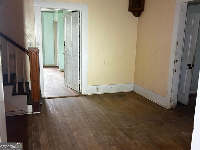 unfurnished room featuring dark hardwood / wood-style floors