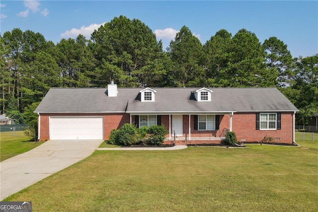 new england style home with a garage and a front lawn