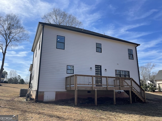 rear view of house featuring a wooden deck and cooling unit