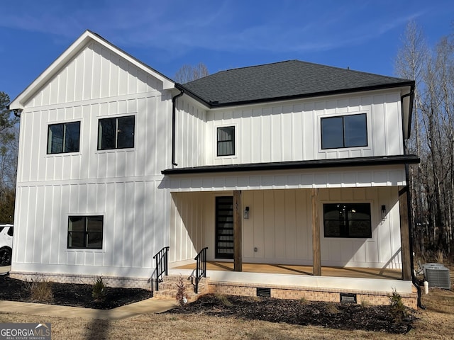 modern farmhouse with a porch and central air condition unit