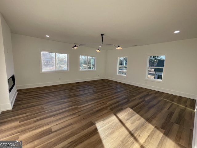 spare room with dark hardwood / wood-style flooring