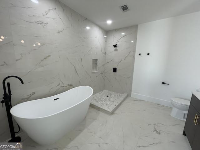 bathroom featuring vanity, a bath, and toilet