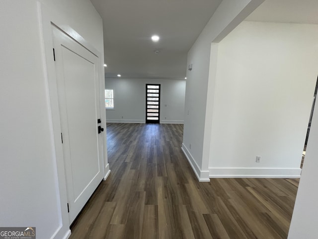 corridor featuring dark hardwood / wood-style flooring