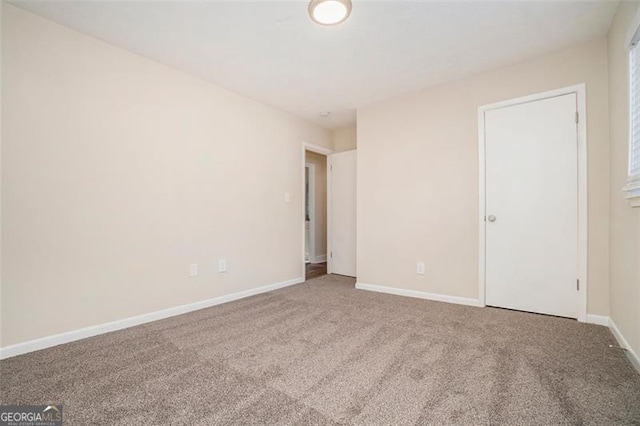 empty room featuring carpet flooring