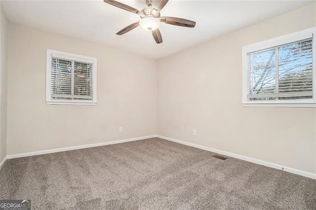 unfurnished room with carpet floors and ceiling fan