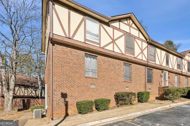 view of side of property with central AC unit