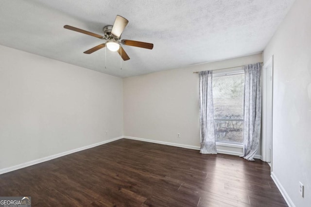 unfurnished room with dark hardwood / wood-style floors, ceiling fan, and a textured ceiling