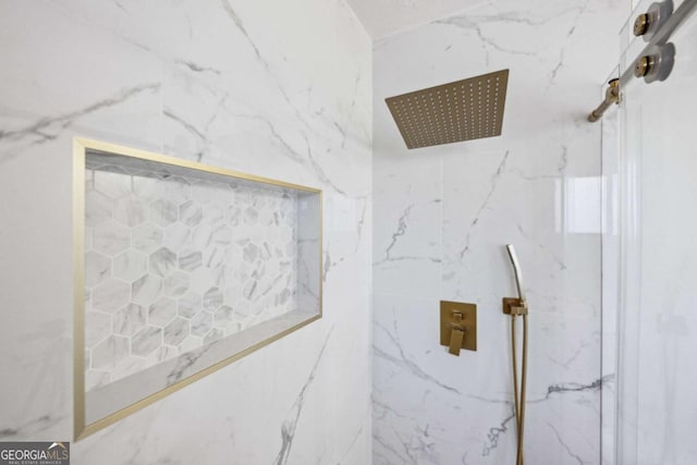 room details featuring a tile shower